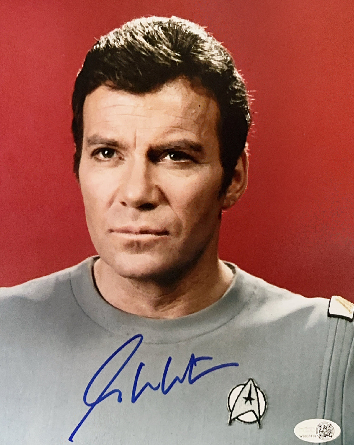 William Shatner Autographed Star Trek Red Background Headshot 8x10 Photo JSA product image 1, provided for visual reference